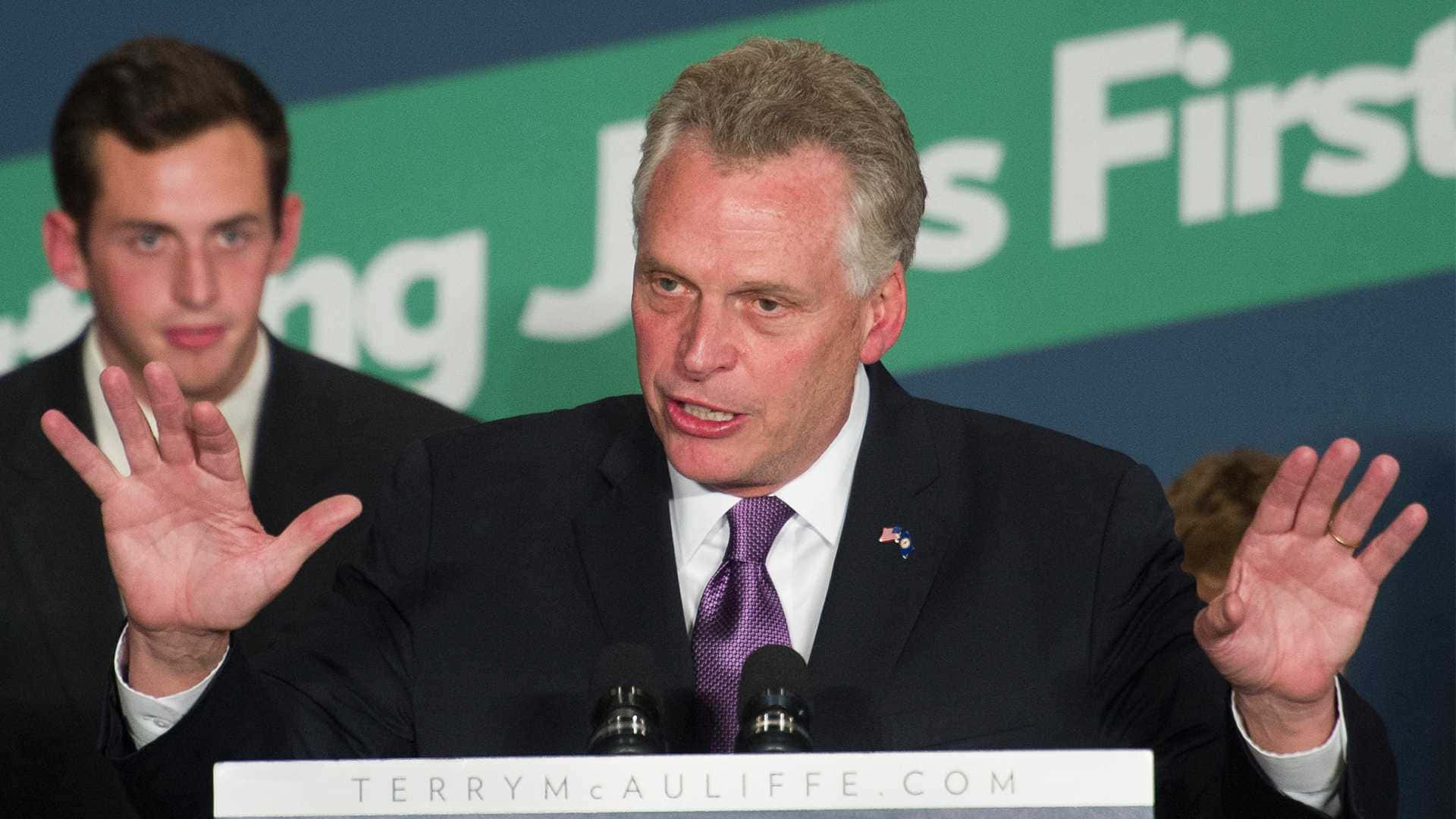 Terry Mcauliffe Delivering A Powerful Speech. Background