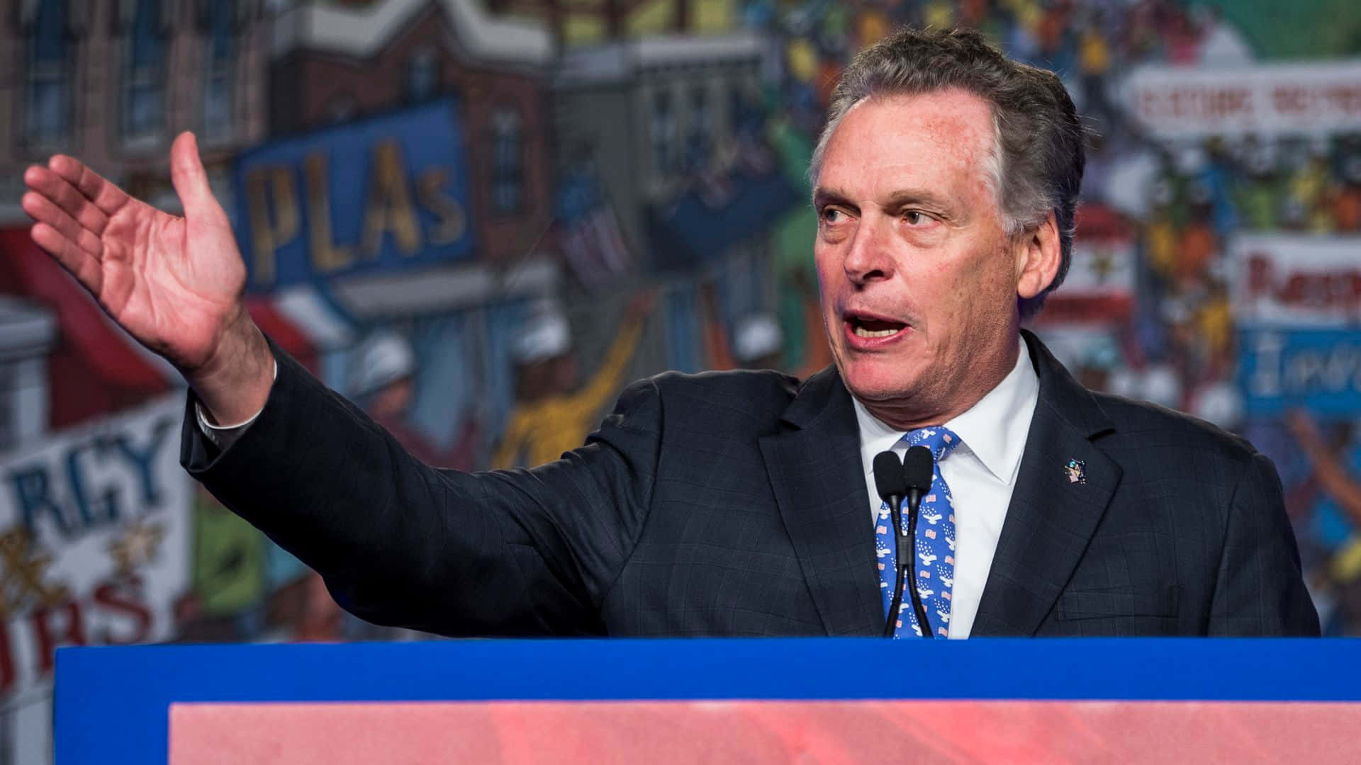 Terry Mcauliffe Delivering A Speech Background