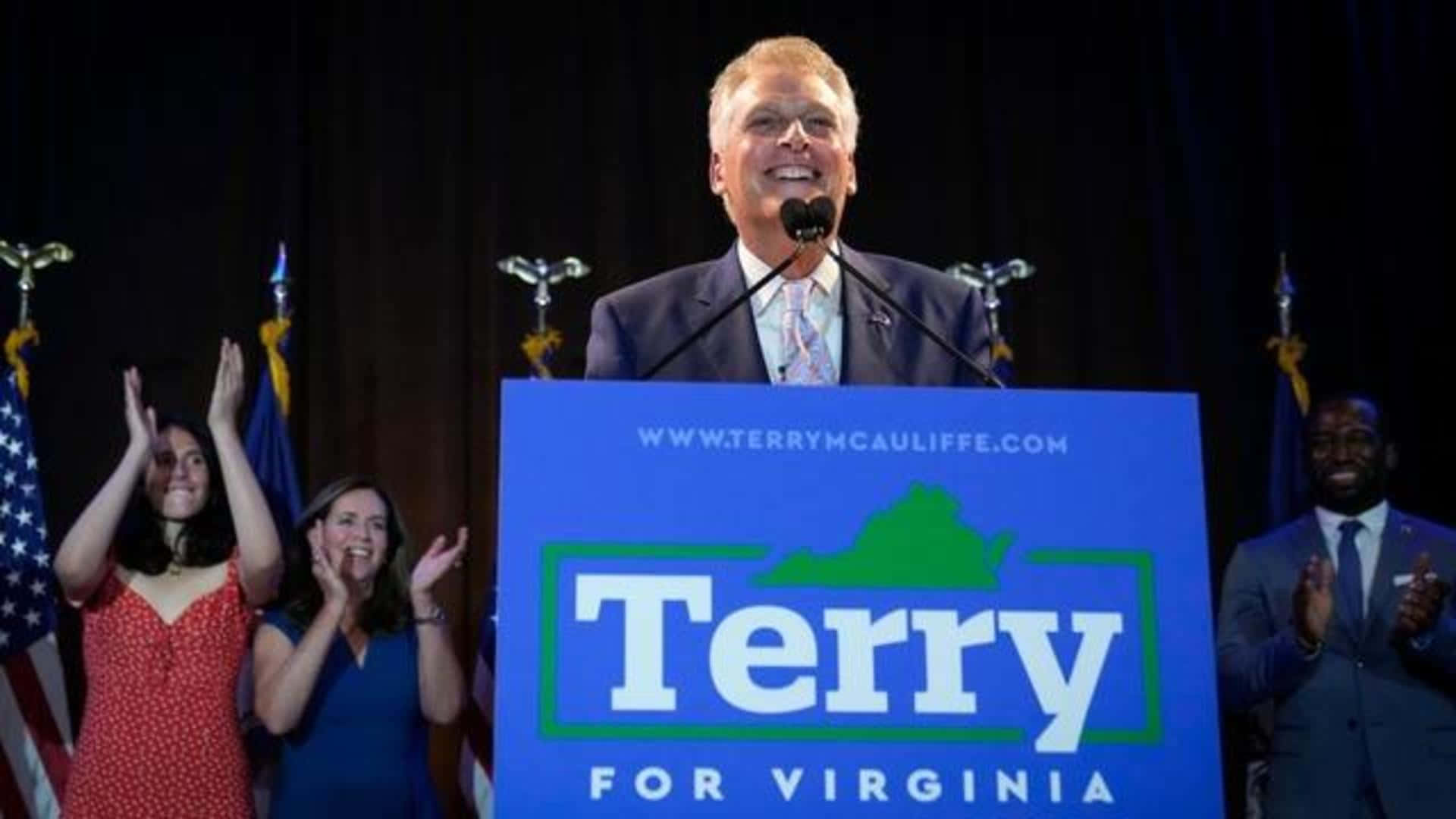Terry Mcauliffe Delivering Speech At A Rally. Background