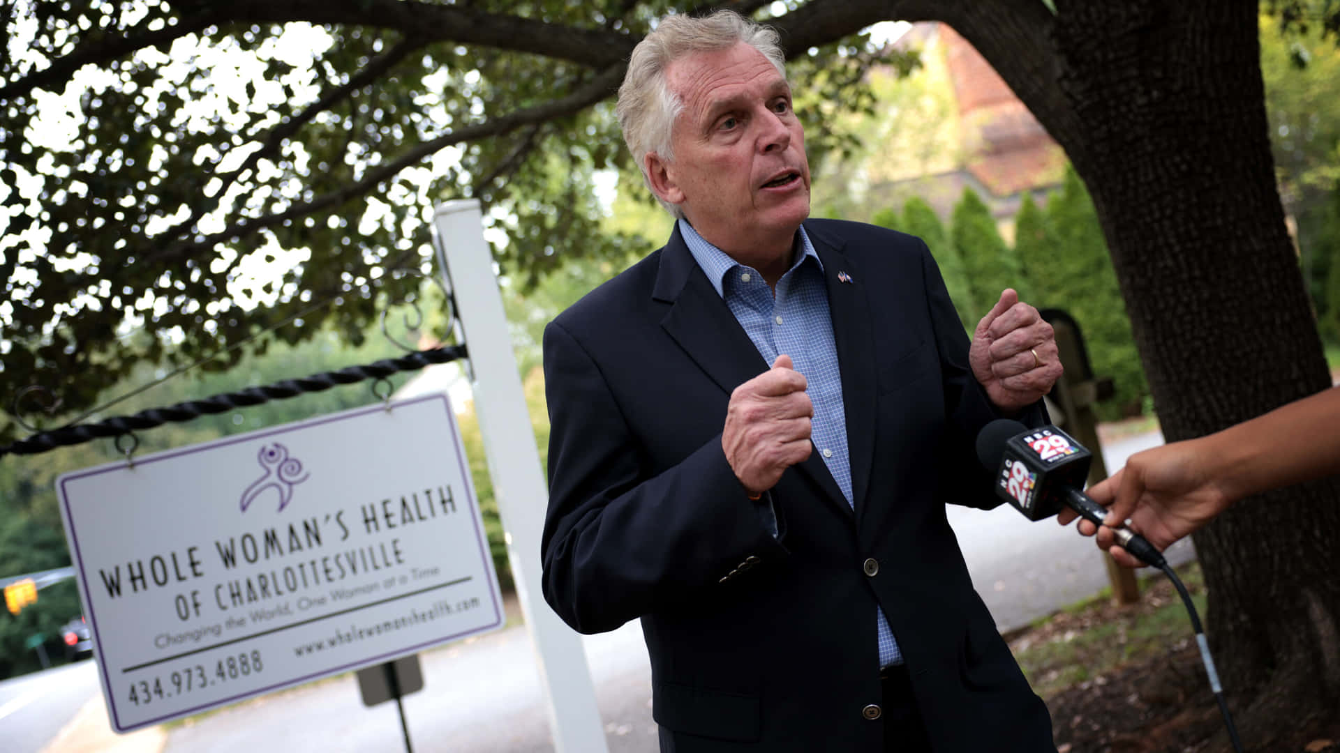 Terry Mcauliffe During A Visit At The Whole Woman's Health Clinic Background