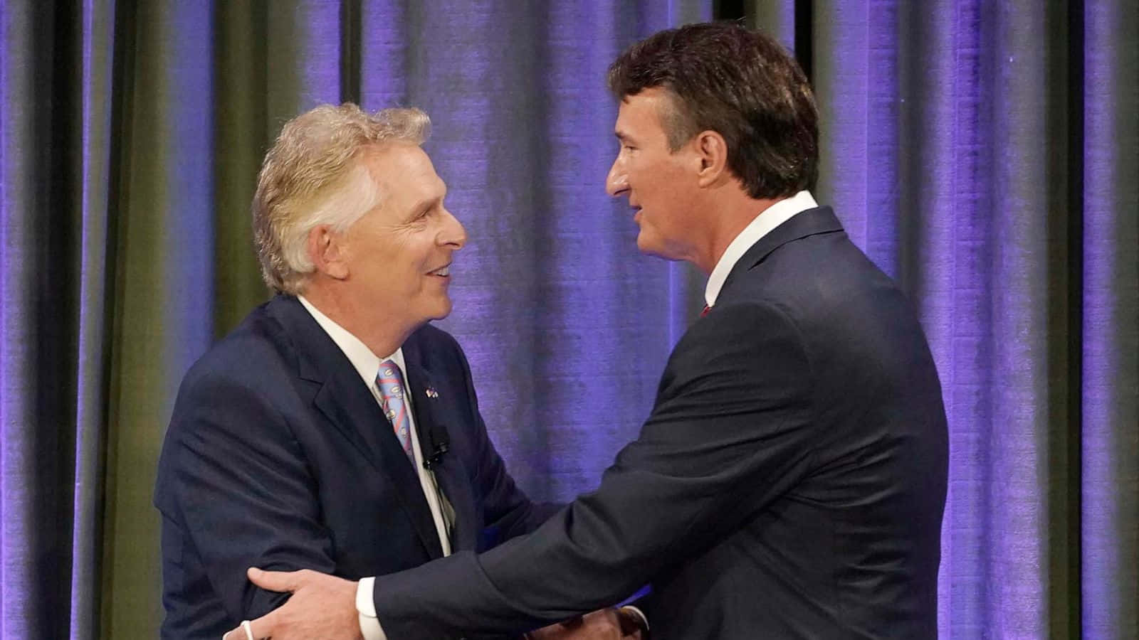 Terry Mcauliffe Shaking Hands With Glenn Youngkin Background