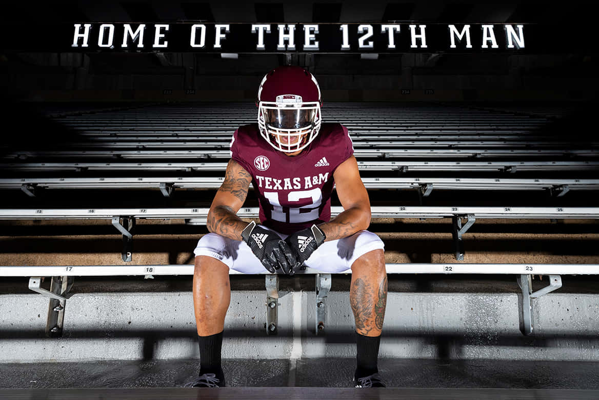 Texas Am Man In A Football Uniform Sitting On The Bleachers Background