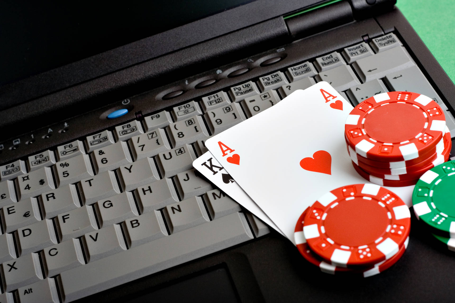 Texas Hold'em Chips And Laptop Background