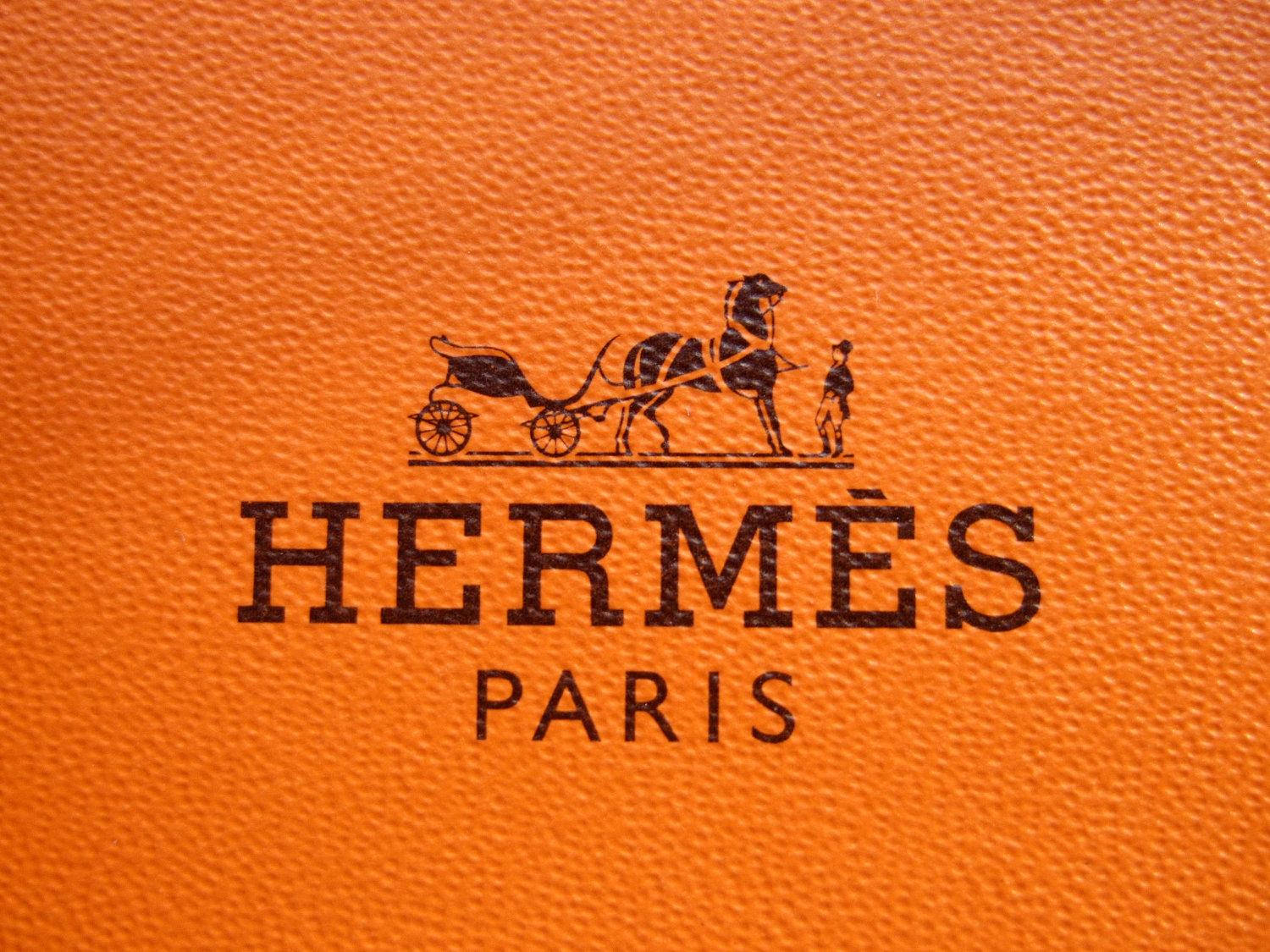 Textured Orange Hermes Logo Background