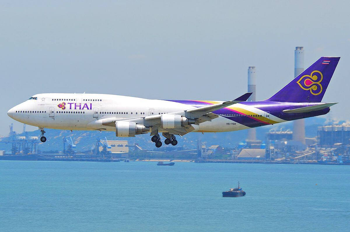 Thai Airways Airplane Above The Ocean Background