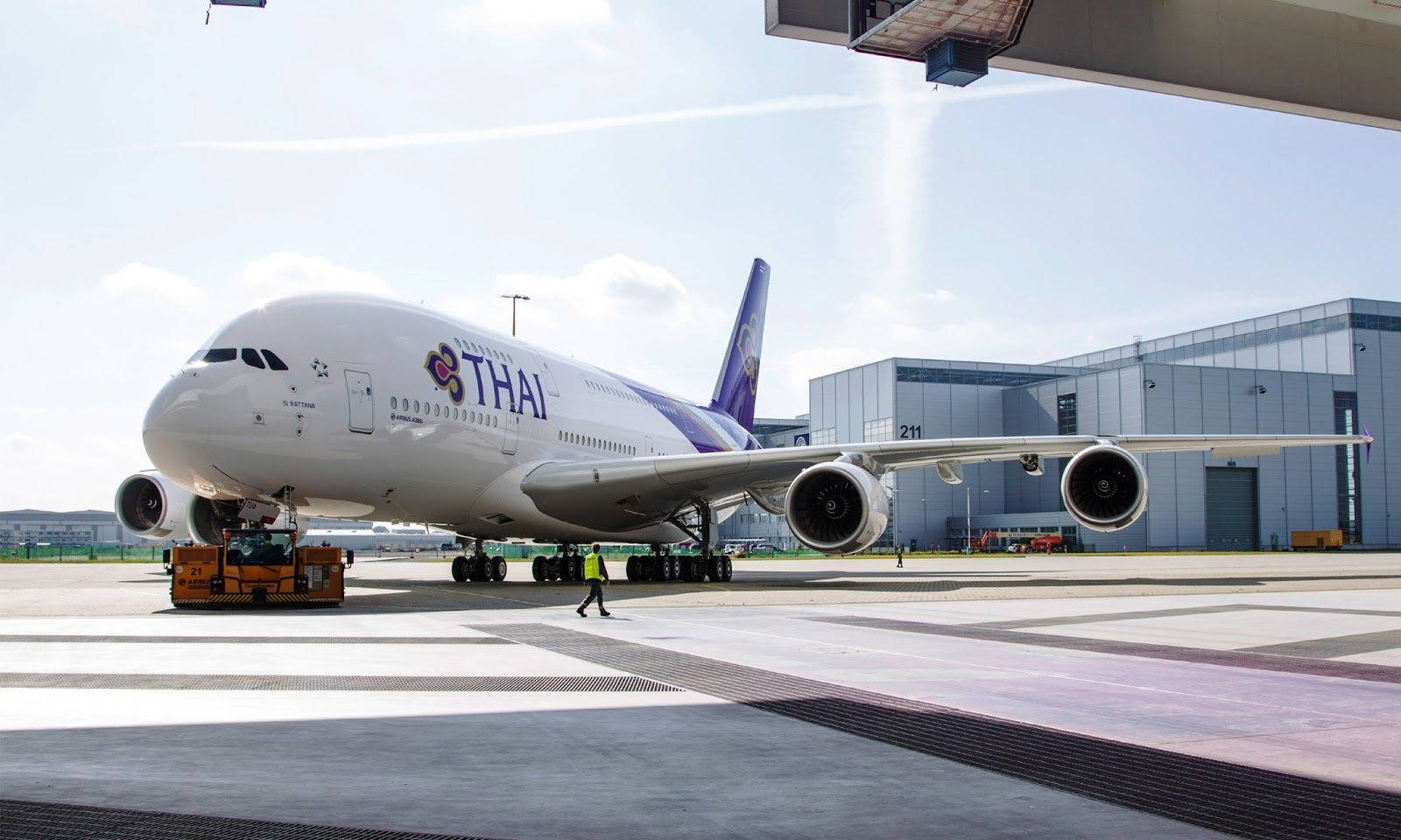 Thai Airways Airplane On Airport Background