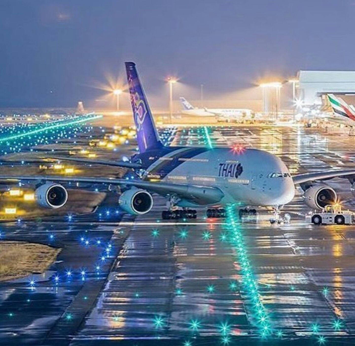 Thai Airways Airplane On Bright Airport Background