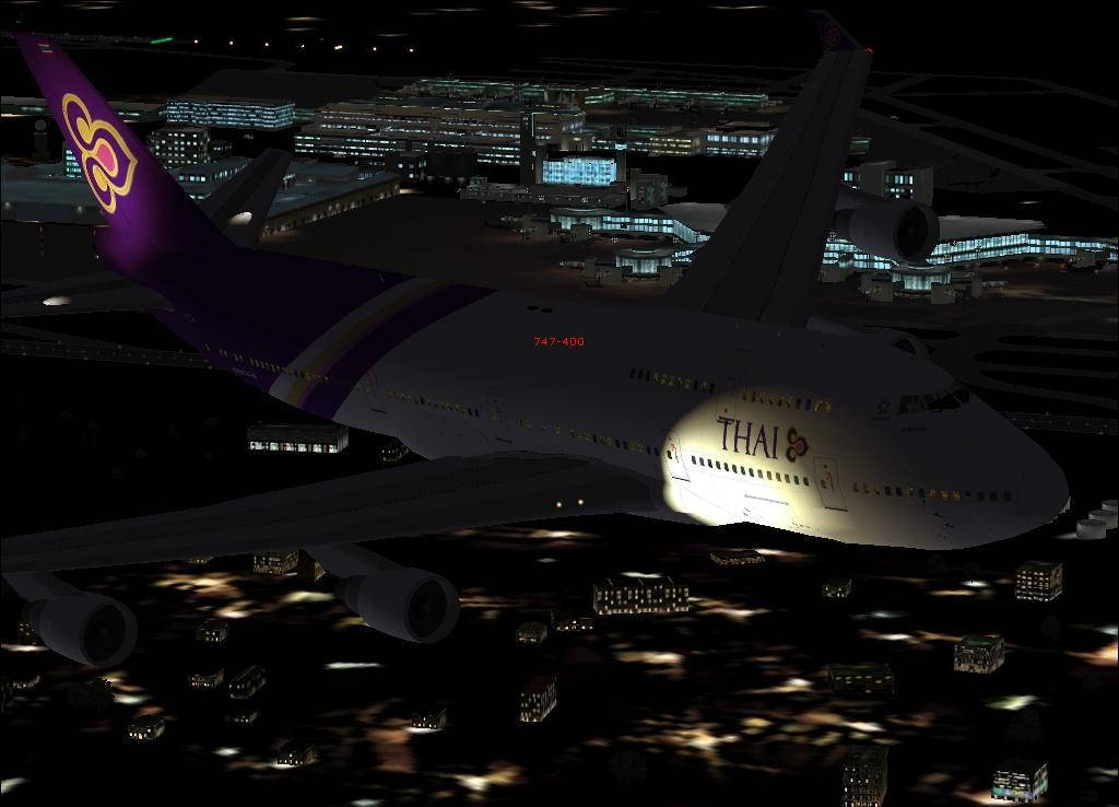 Thai Airways Airplane With City Buildings Background