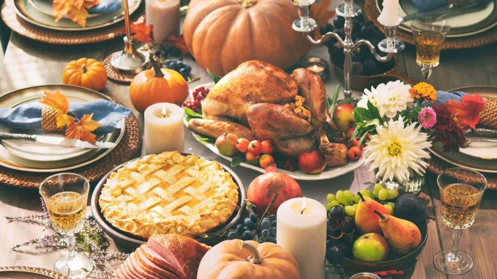 Thanksgiving Table With Turkey, Pumpkins, And Other Food Background