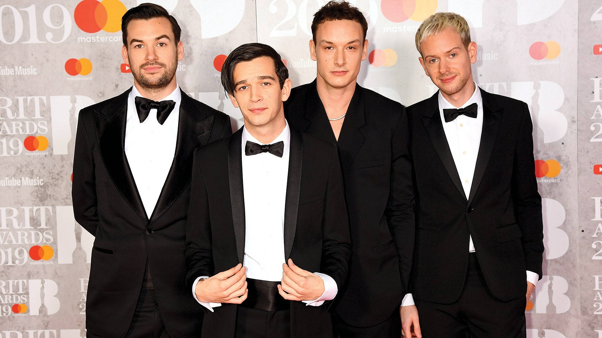 The 1975 Band In Tuxedo Suit Background