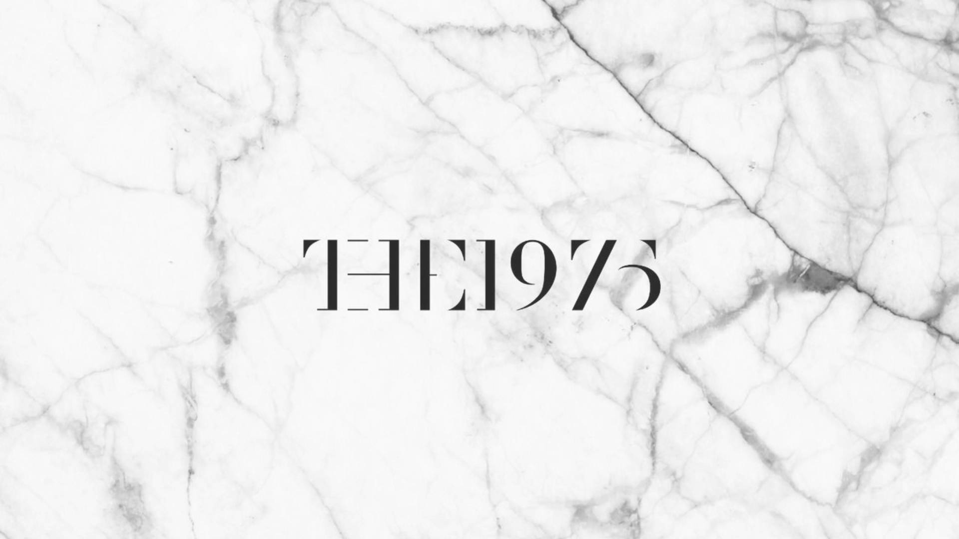 The 1975 On White Marble Background