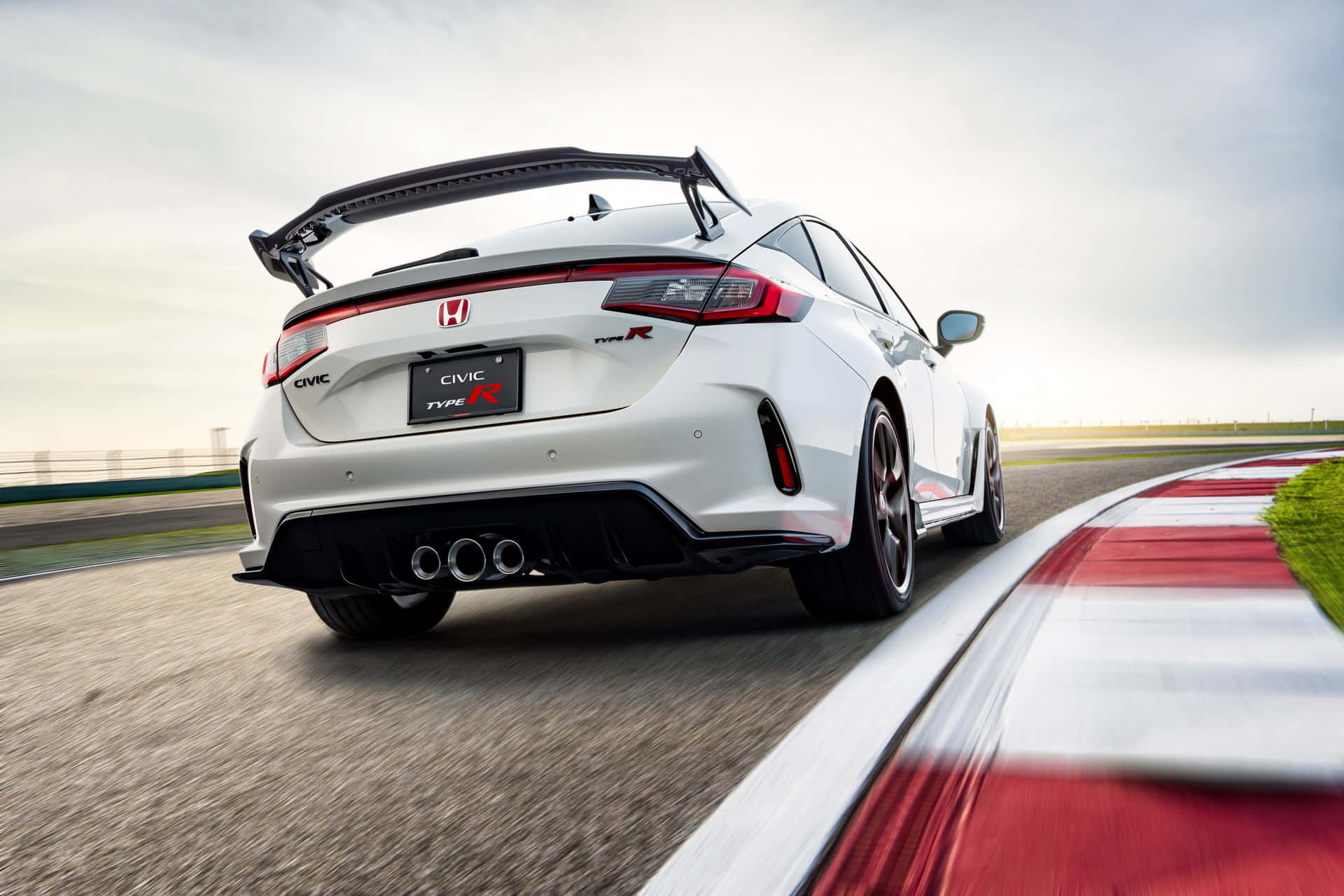 The 2019 Honda Civic Type R Is Driving On A Race Track Background