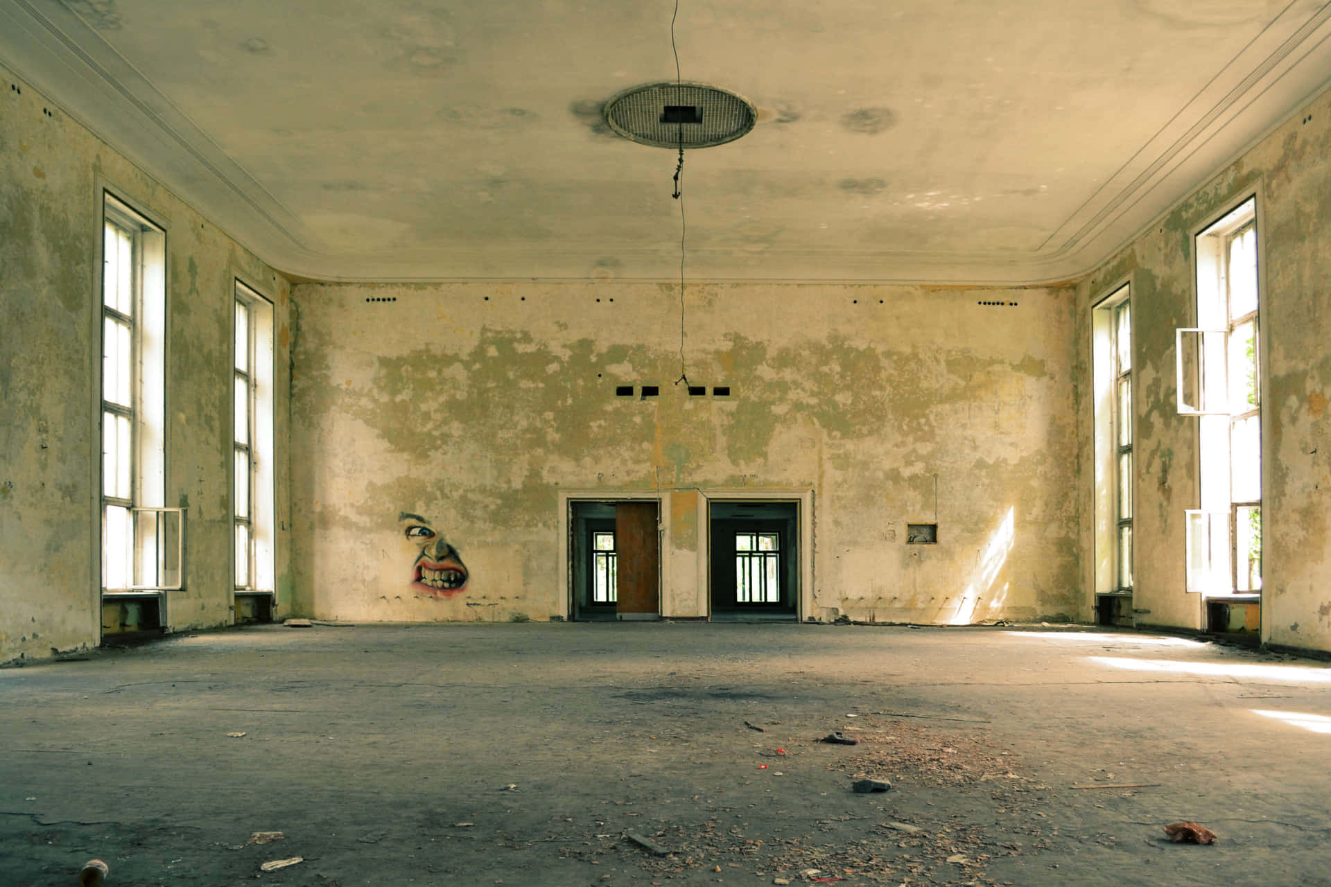 The Aesthetic Of Abandonment: An Empty Room With A Torn Chandelier