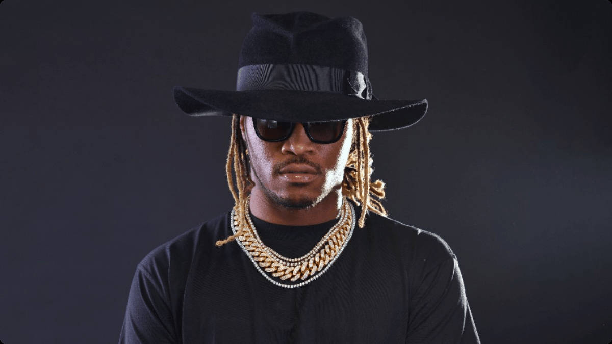 The Astounding Vision Of Future Rapper In A Black Hat Background