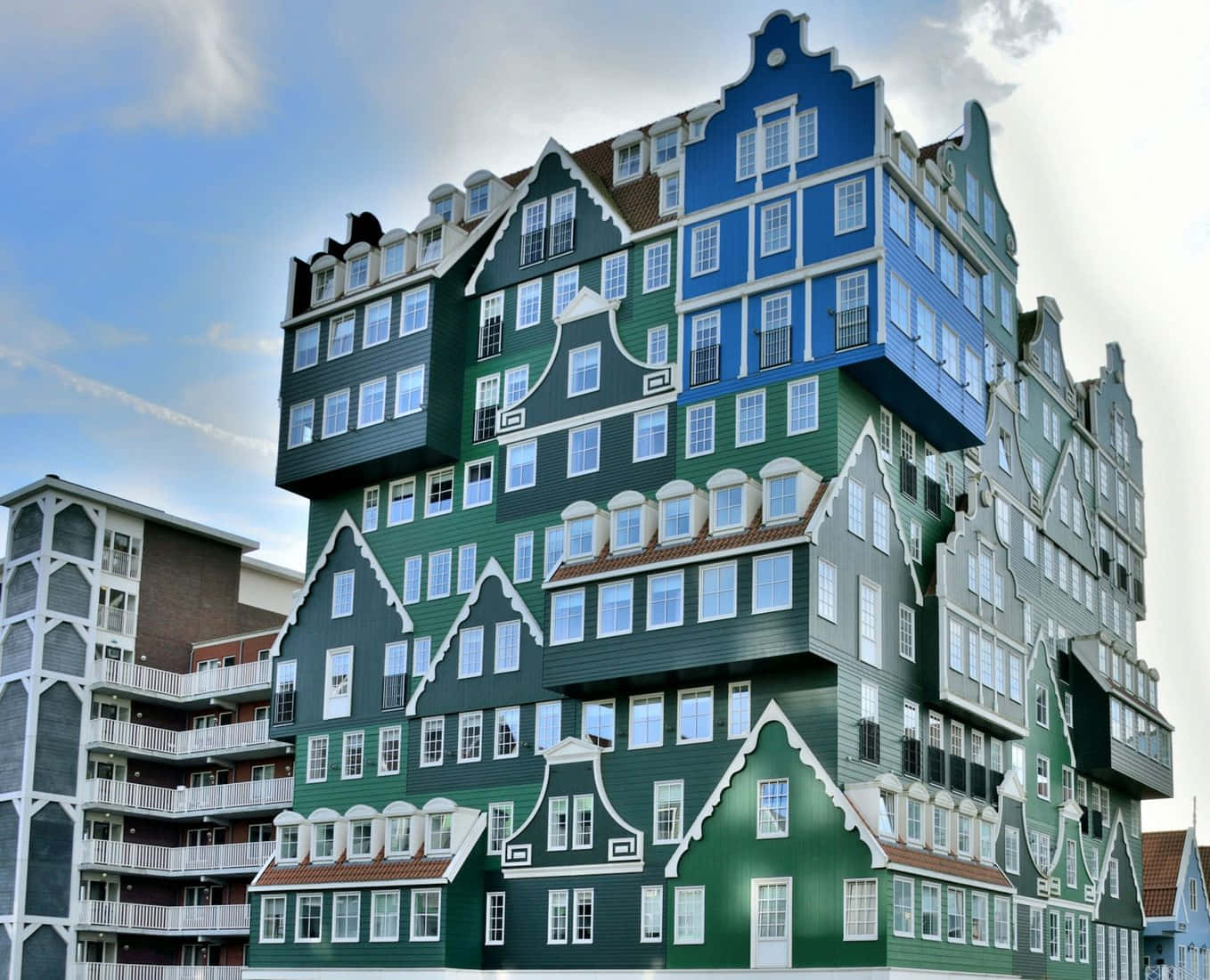 The Awe-inspiring Design Of Inntel Hotel Zaandam Against A Bright Blue Sky Background