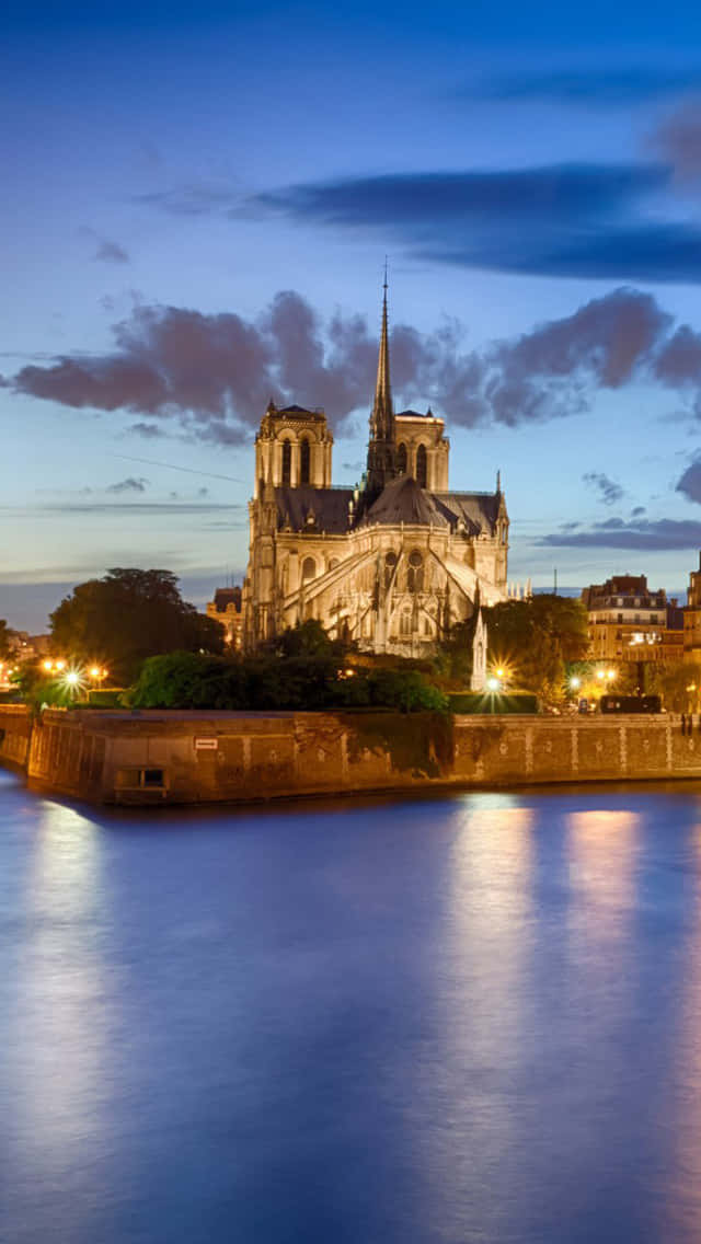 The Back Of Notre Dame Cathedral After Sunset Background
