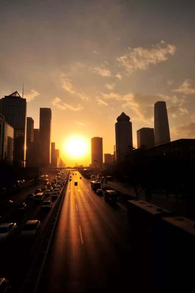 The Beauty Of The City Skyline At Sunset Background