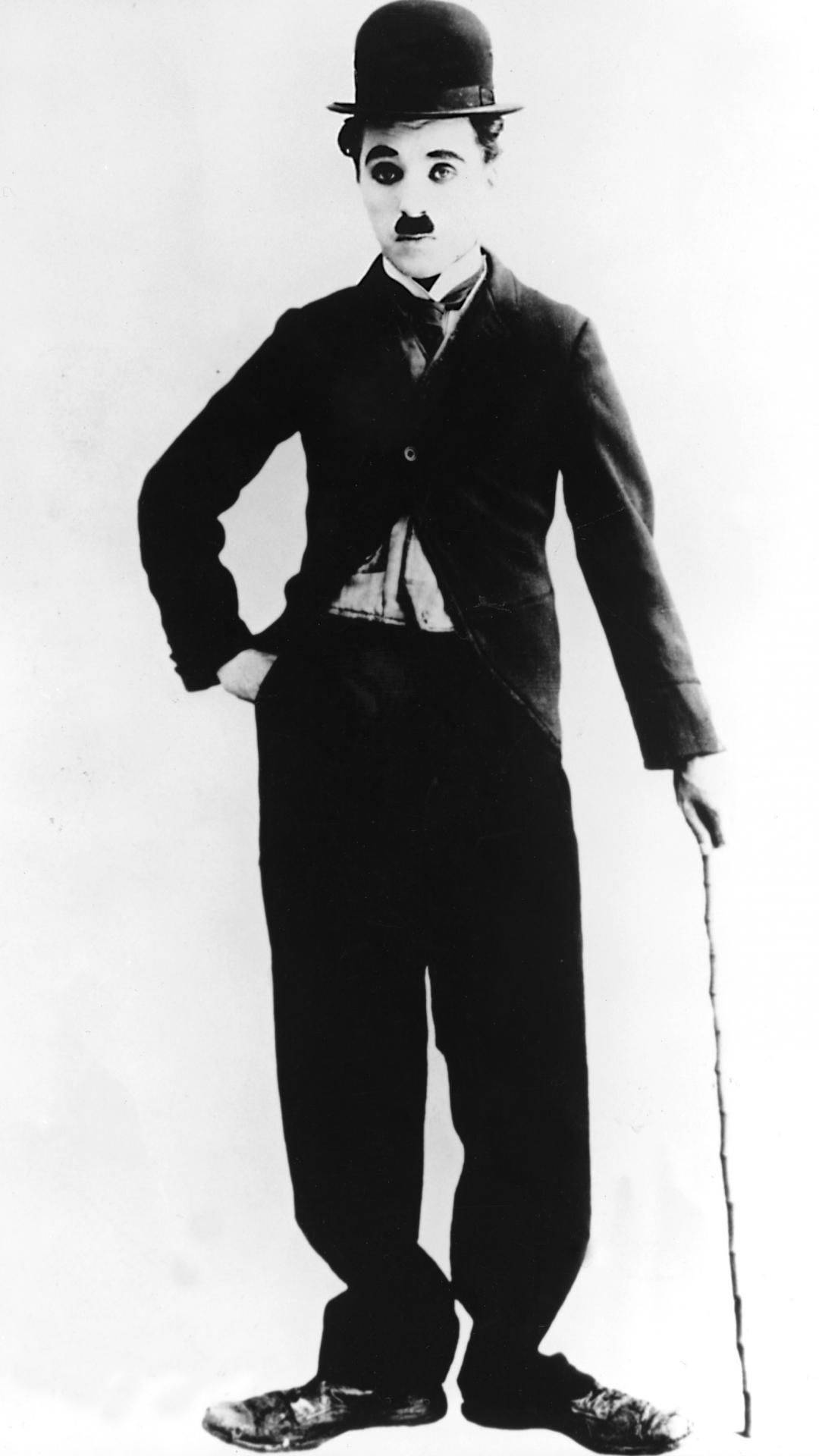“the Beloved Character Actor, Charlie Chaplin, In A Dynamic Pose” Background