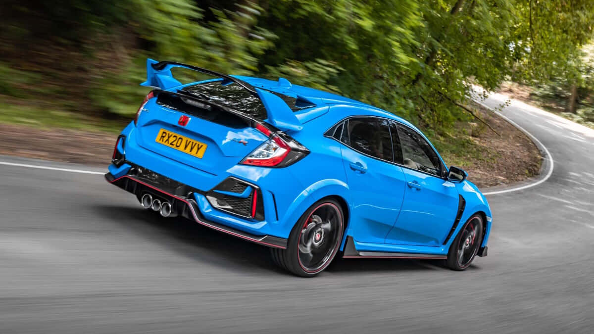 The Blue Honda Civic Type R Driving Down A Winding Road Background
