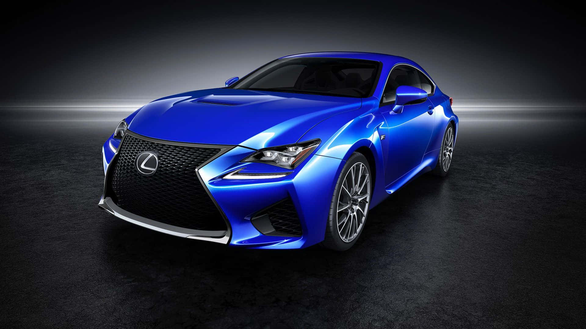 The Blue Lexus Rc Is Shown In A Dark Background