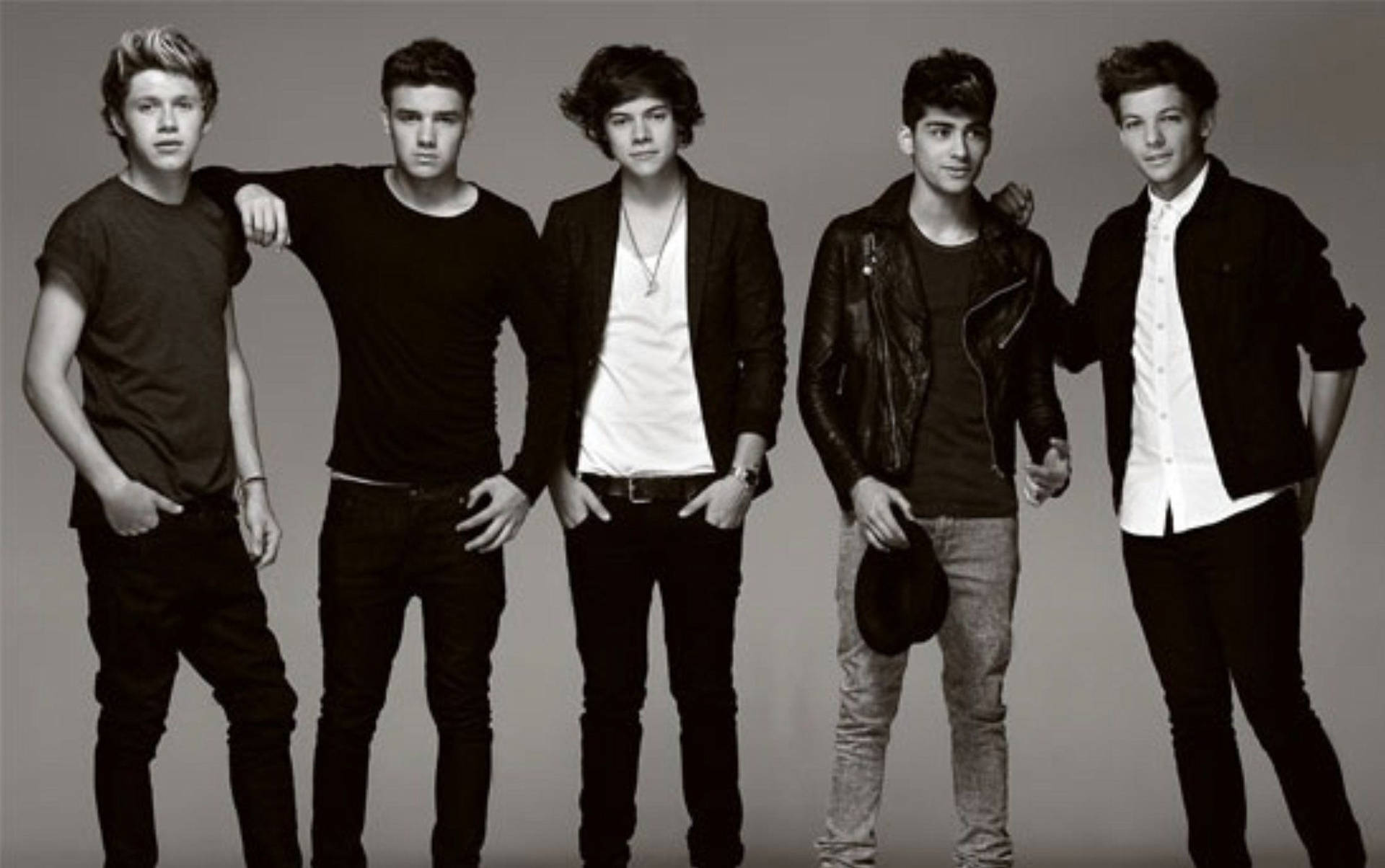 The Boys Of One Direction Pose For A Charming Black And White Photo Background