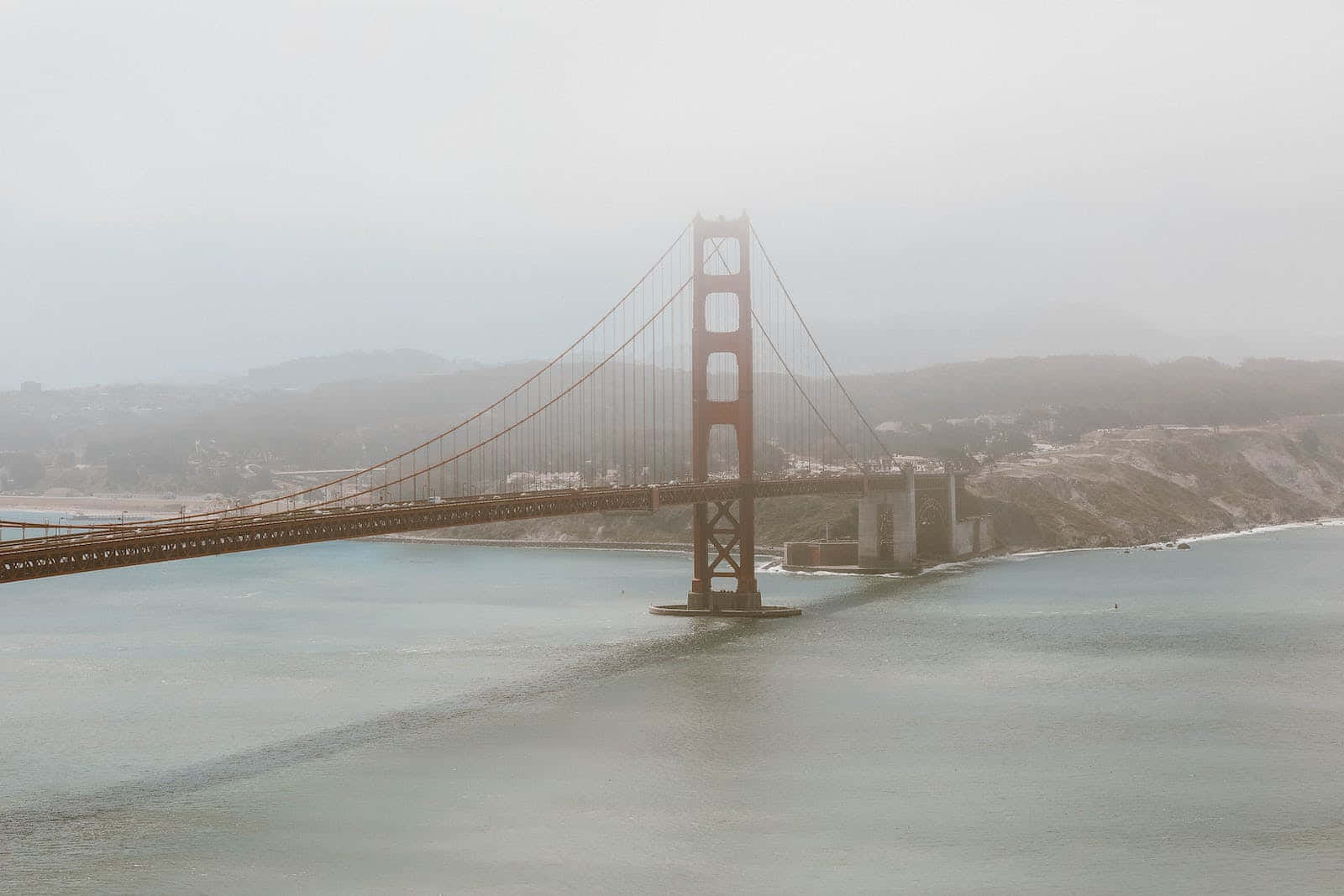 The Bright City Lights Of San Francisco, Shrouded In Fog Background