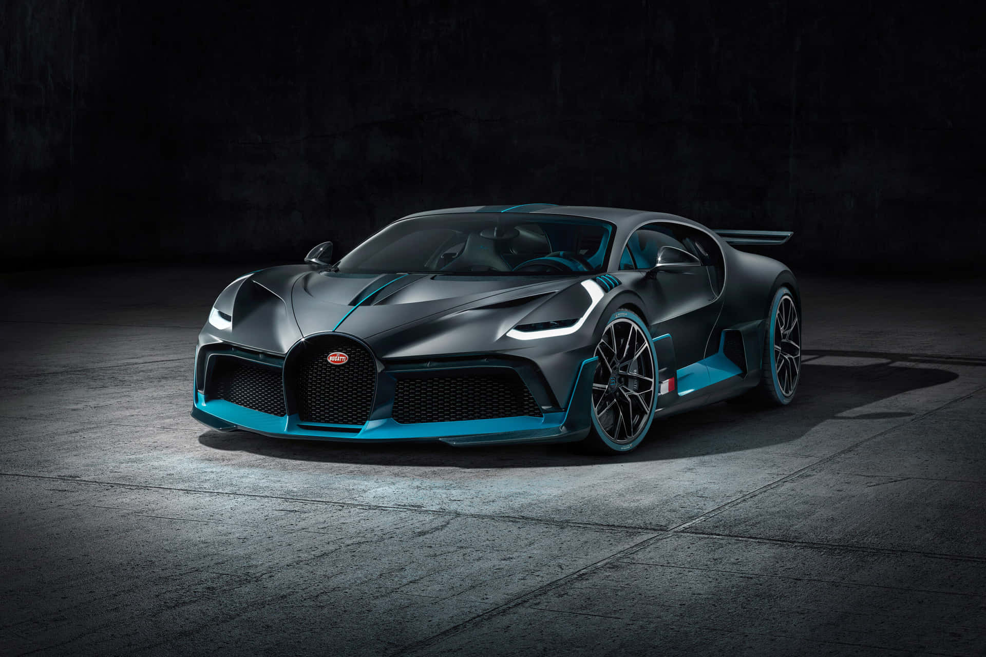 The Bugatti Chiron Is Shown In A Dark Room Background