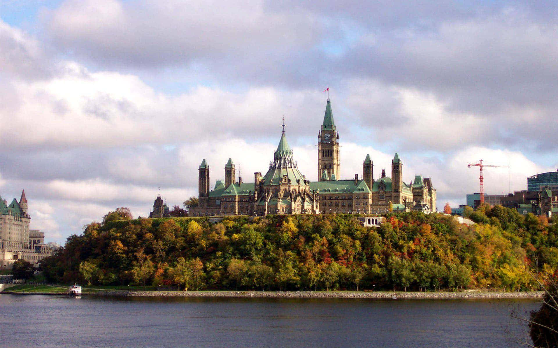 The Canadian Parliament Buildings At The Heart Of The Nation Background
