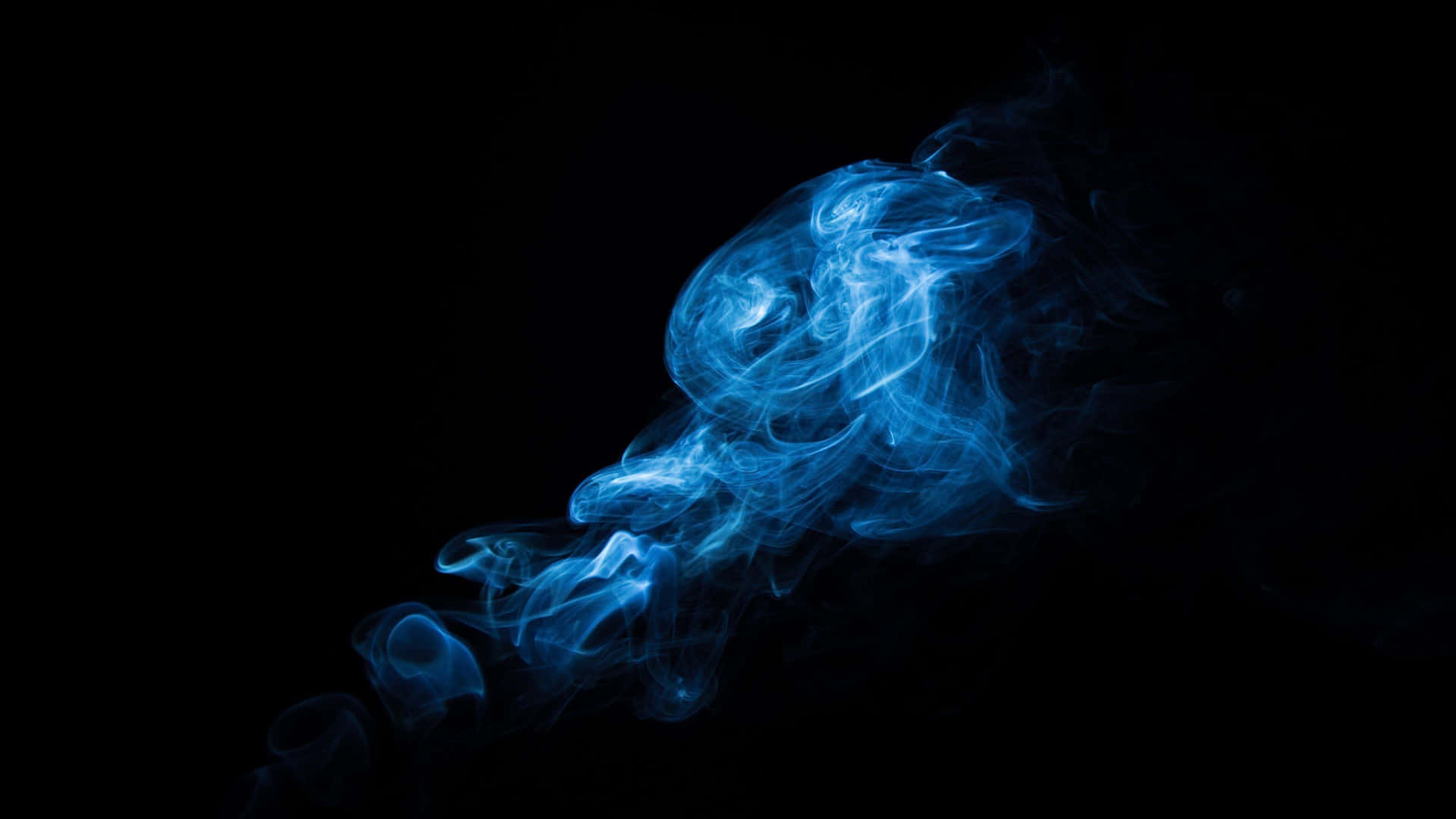 “the Captivating Beauty Of Smoke Dancing In The Night Sky” Background