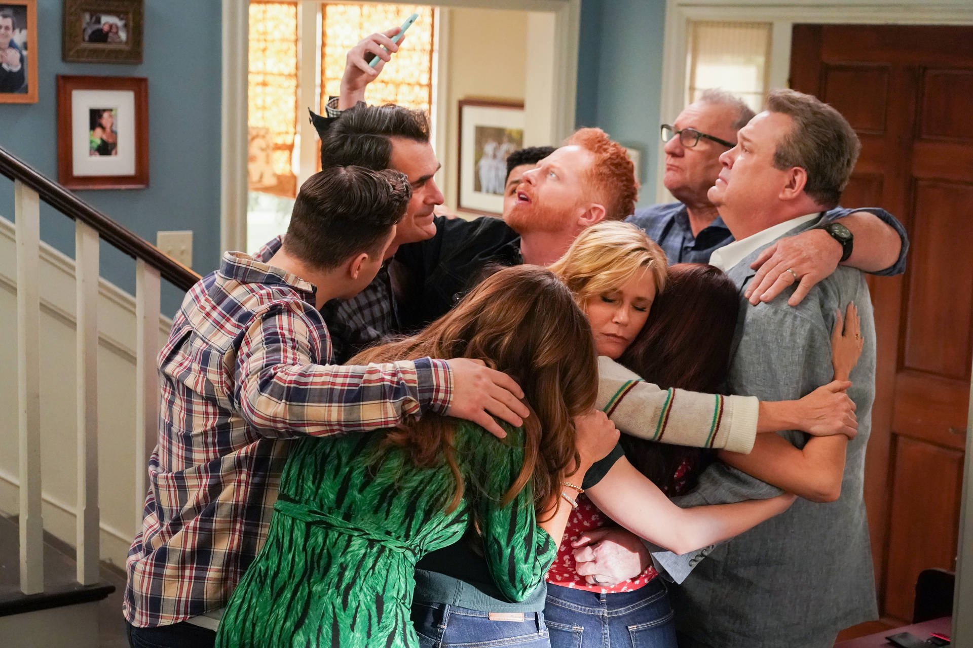 The Cast Of Modern Family Celebrating The Finale With A Group Hug.
