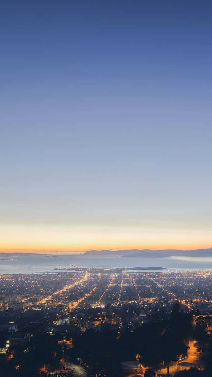 The City Draped In The Golden Glow Of The Setting Sun