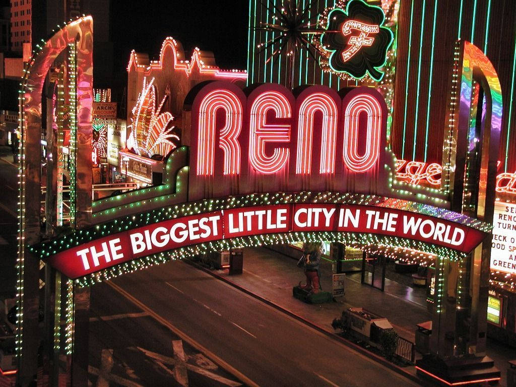 The City Of Reno Illuminated At Night Background