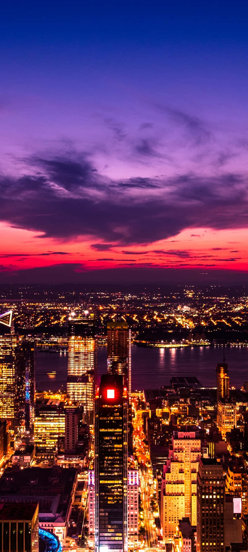 The City's Beauty Shines Brightly At Sunset Background