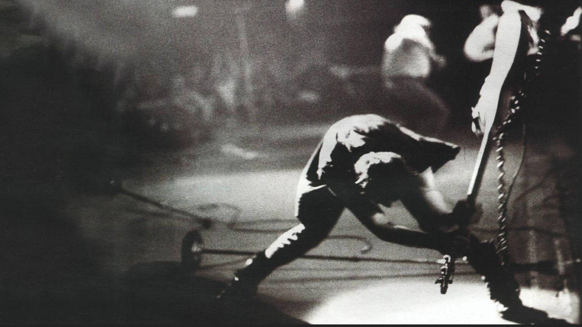 The Clash Paul Simonon Smashing Guitar