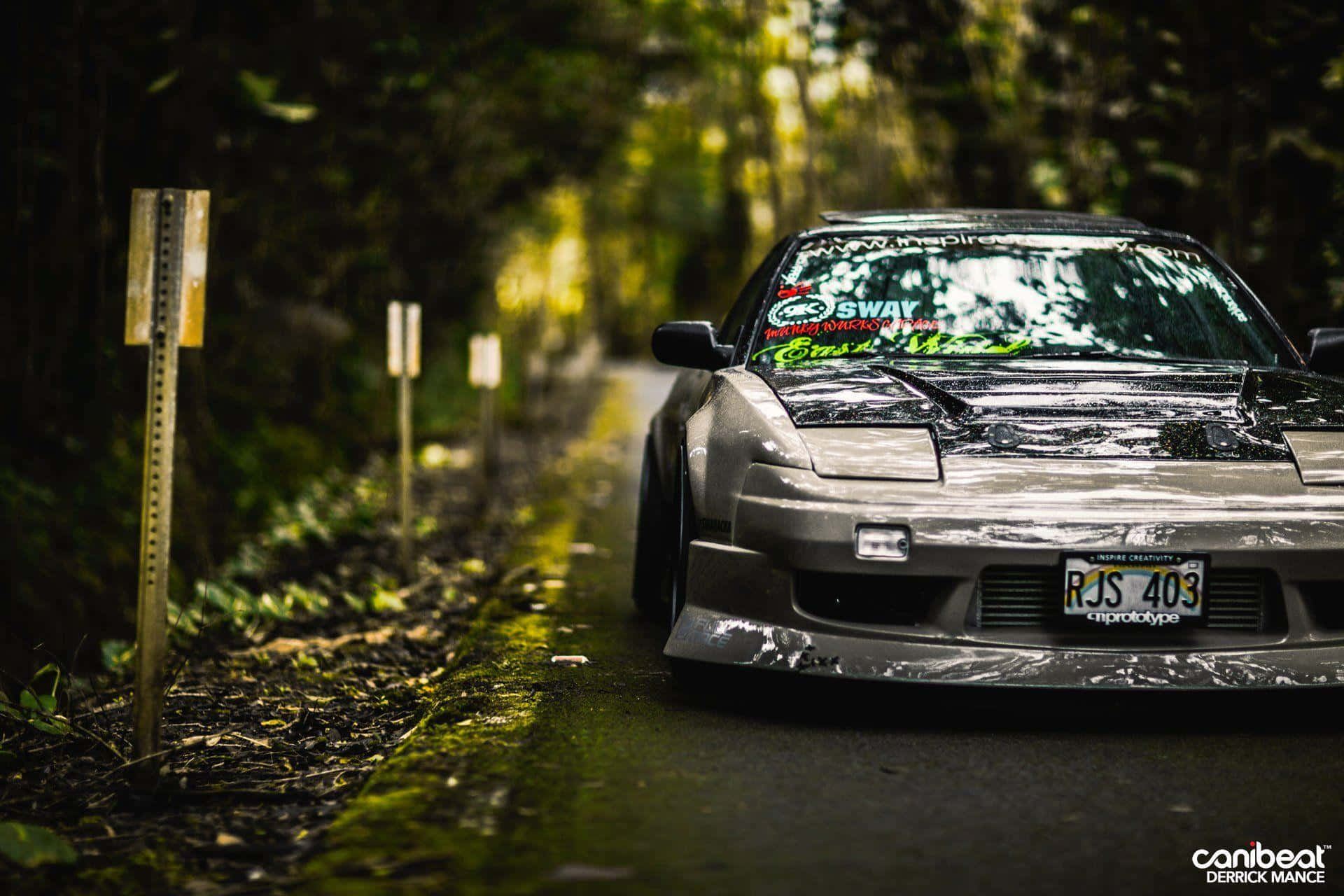 The Classic Nissan Silvia S13 In The Official Yamaha Multimedia Blue Background