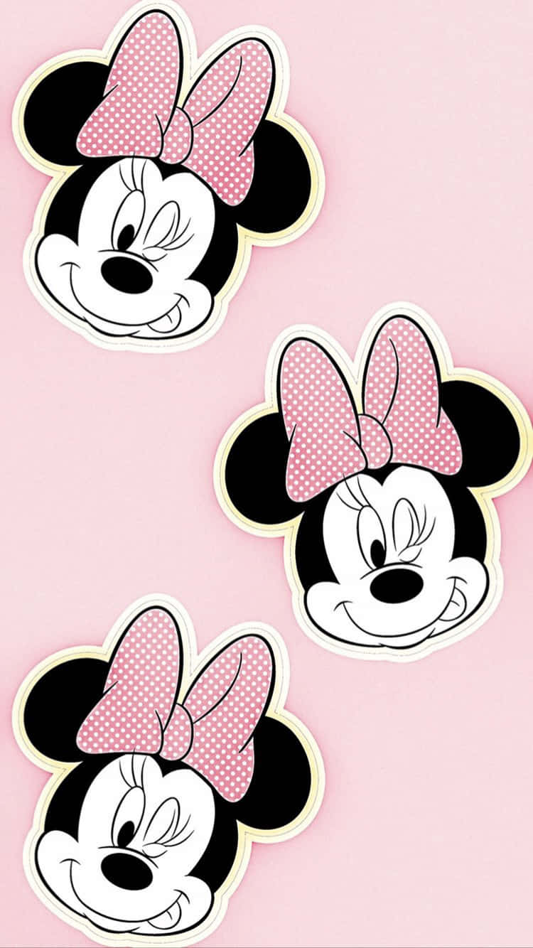 The Cute Minnie Mouse In Her Iconic Pink Dress Background