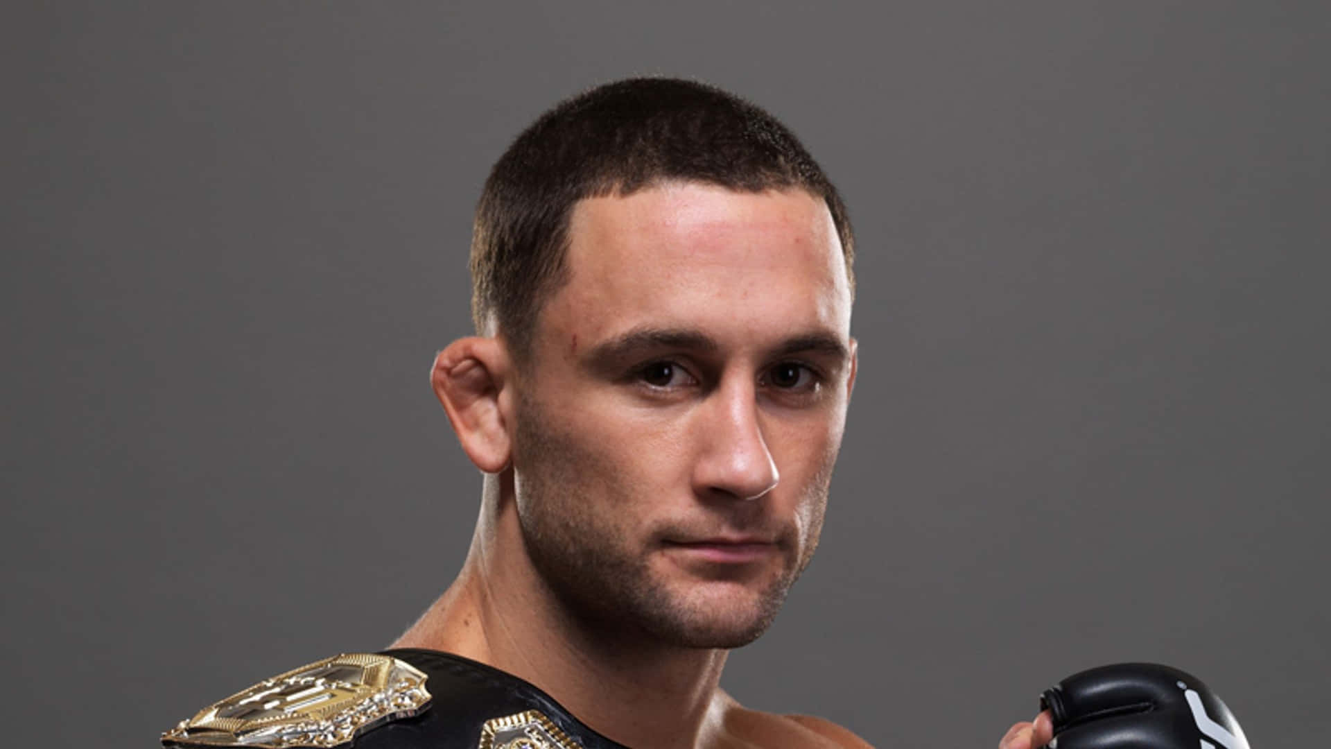 The Determined Gaze Of A Champion - Ufc Fighter Frankie Edgar Background