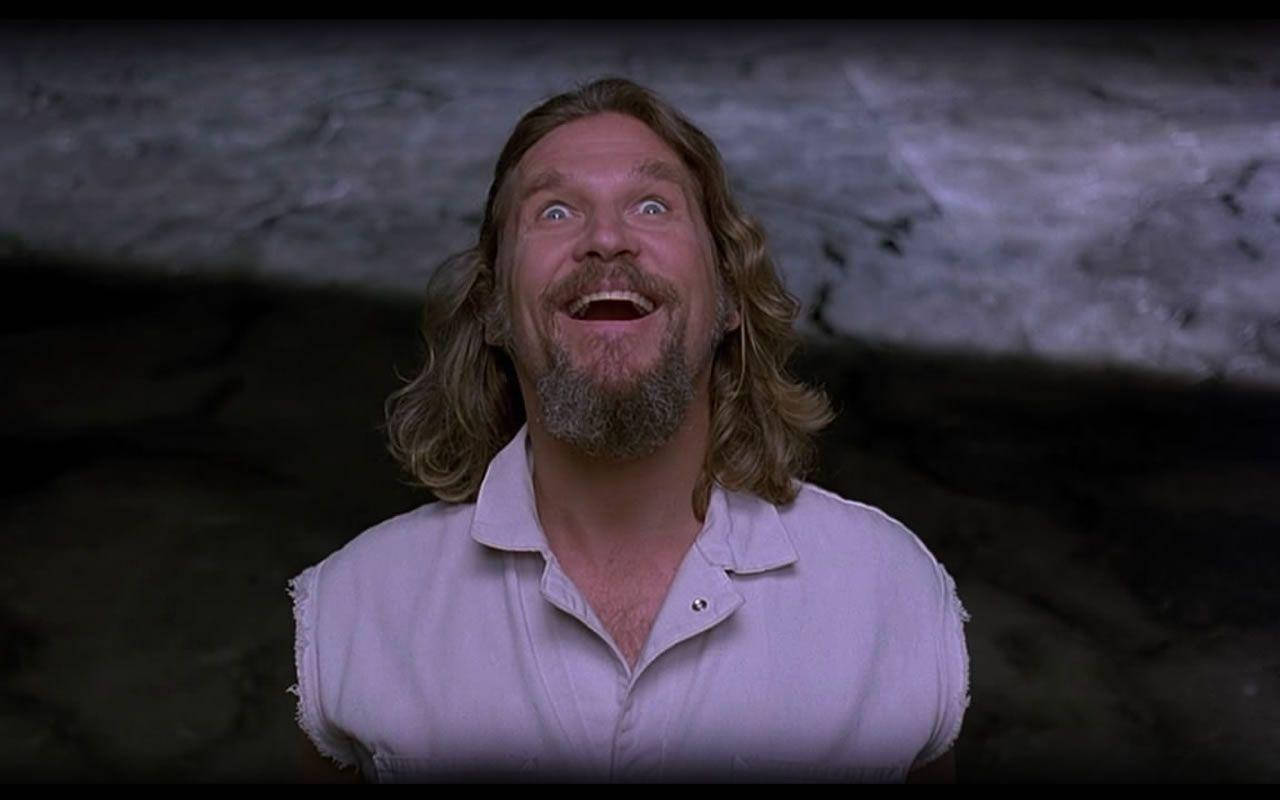 The Dude, The Quirky Character From The Cult-classic Film, The Big Lebowski, Looking Happy In An Iconic Movie Scene. Background
