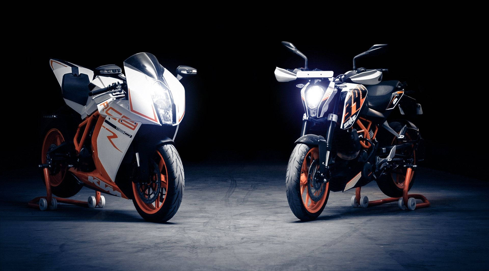 The Dynamic Duo - Ktm Duke 390 & Ktm 1190 Rc8 In Raw Action Background