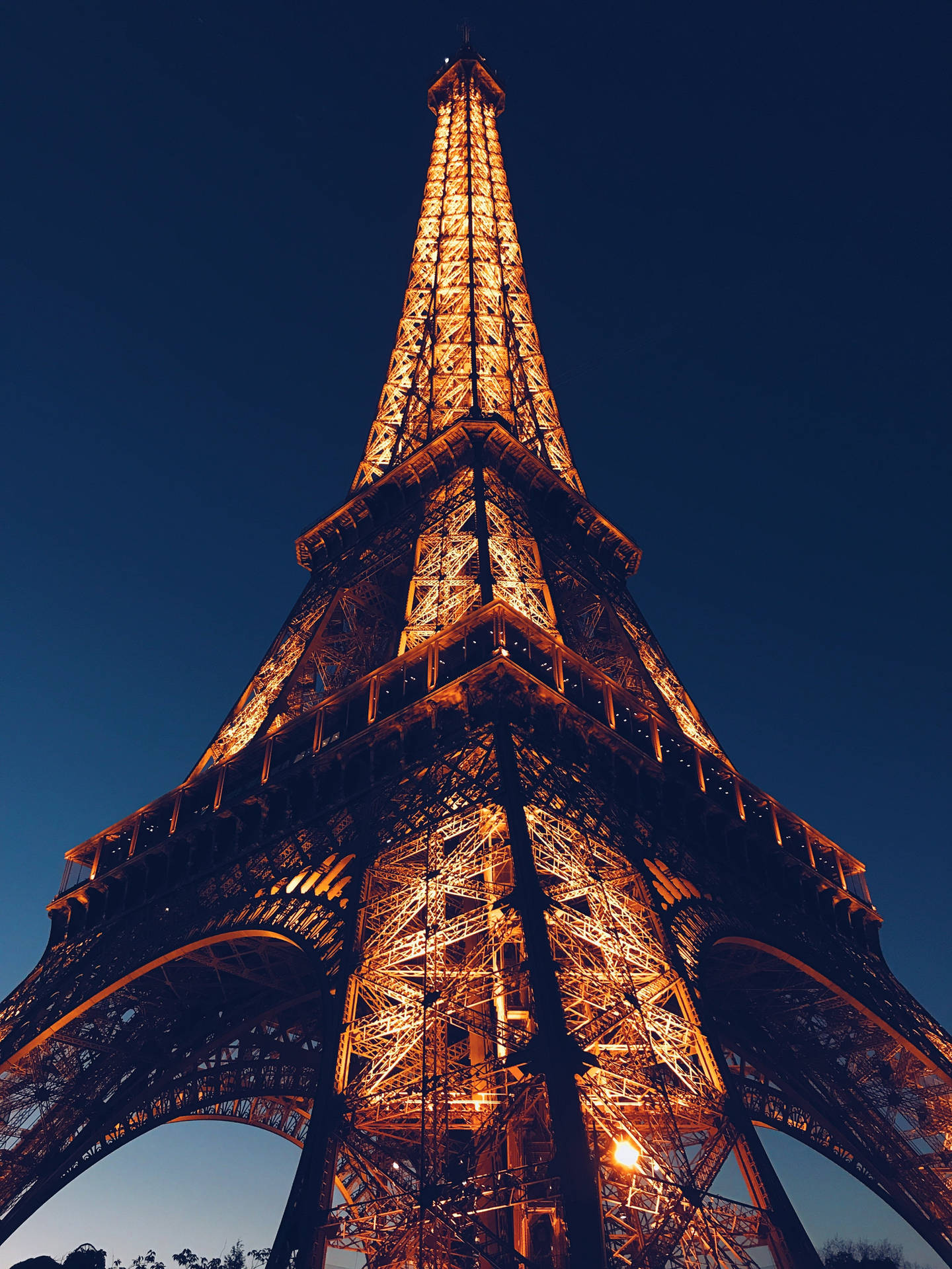 The Eiffel Tower Glittering In The Night Background