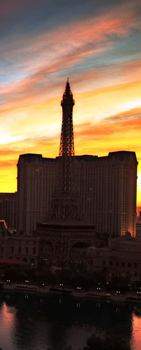 The Eiffel Tower Is In The Background Background