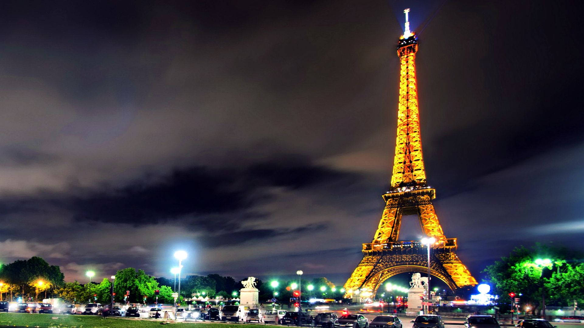 The Eiffel Tower Lit Up At Night Background