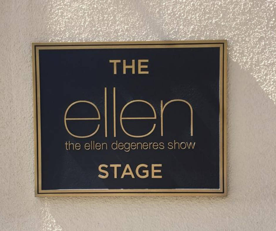 The Ellen Show Sign On A Wall Background