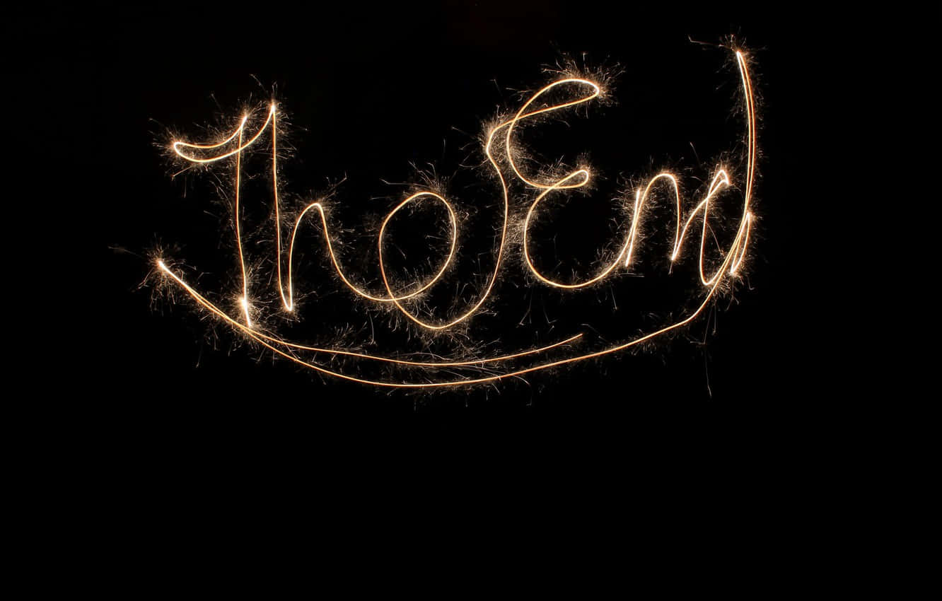 The End Written With Sparklers On A Black Background