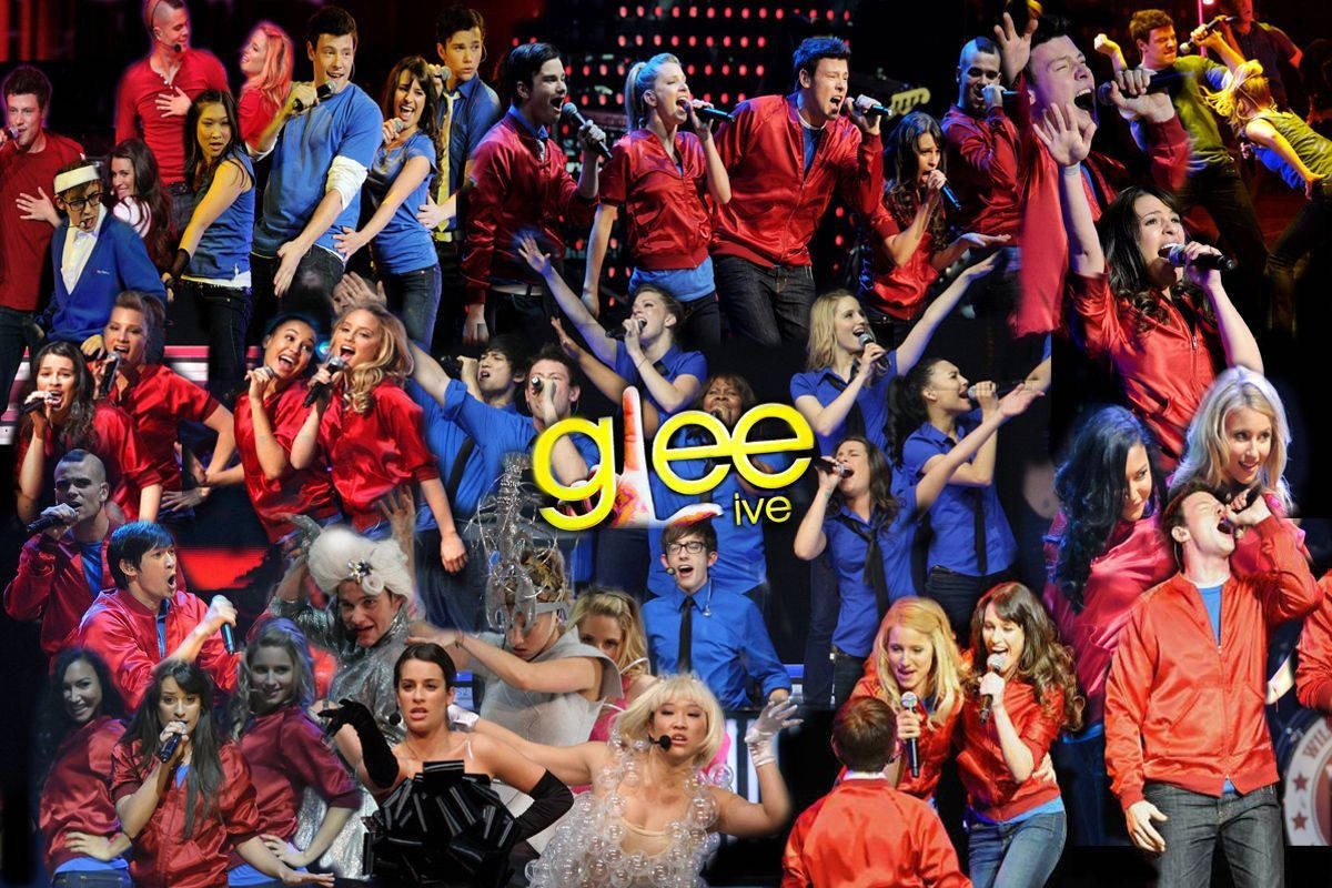 The Energetic Cast Of Glee Performing Live In Concert Background