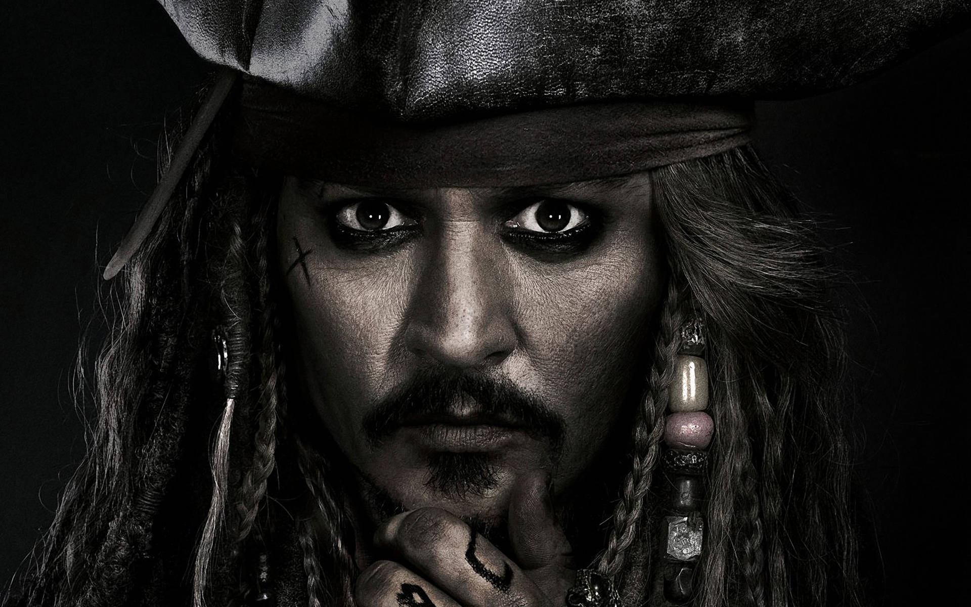 The Enigmatic Captain Jack Sparrow In Monochrome Background