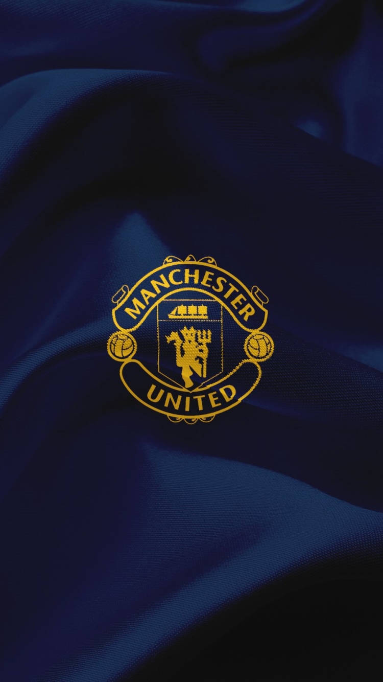 The Esteemed Emblem Of Manchester United Football Club Background