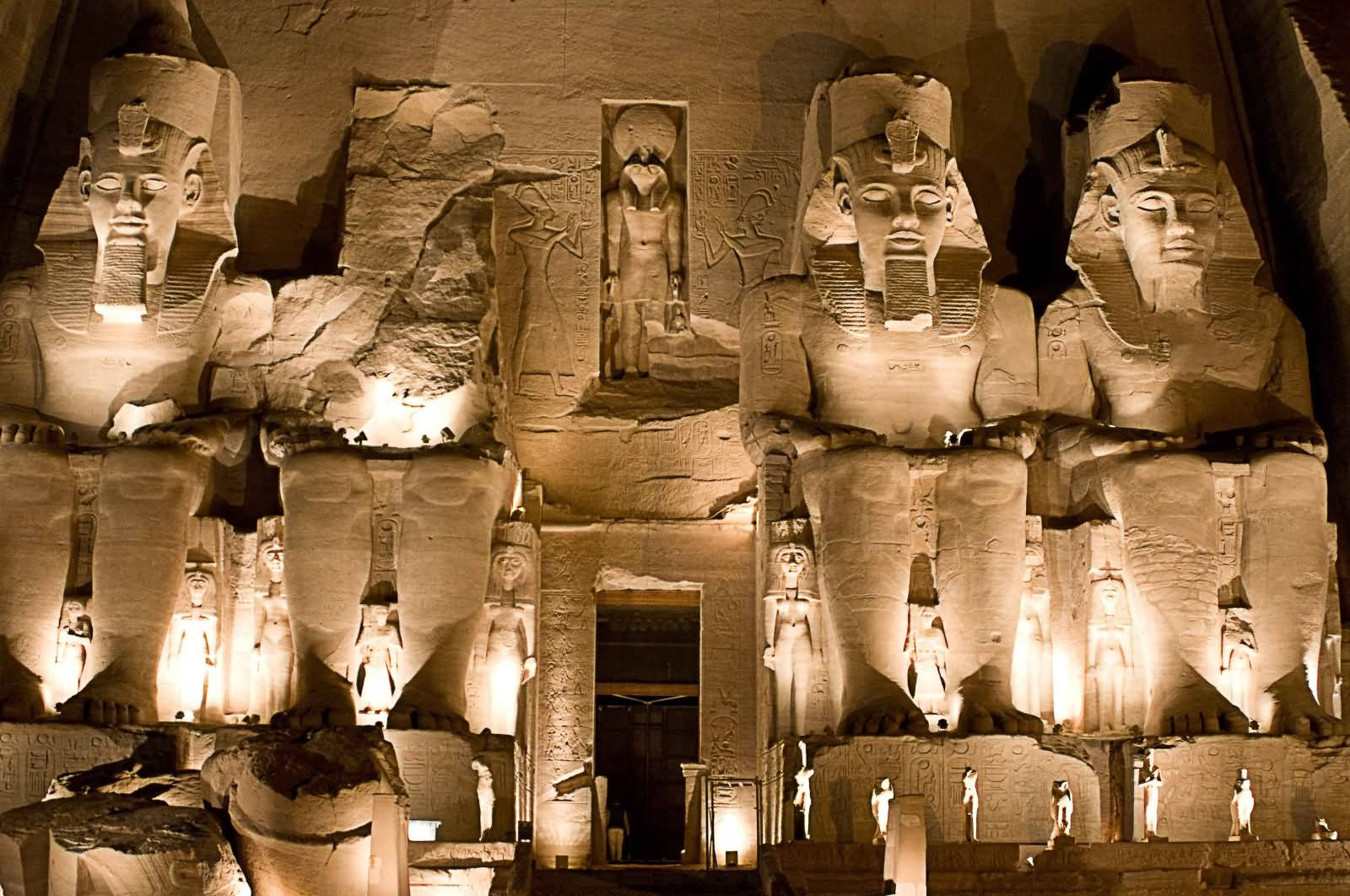 The Façade Of Abu Simbel's Temple At Night Background