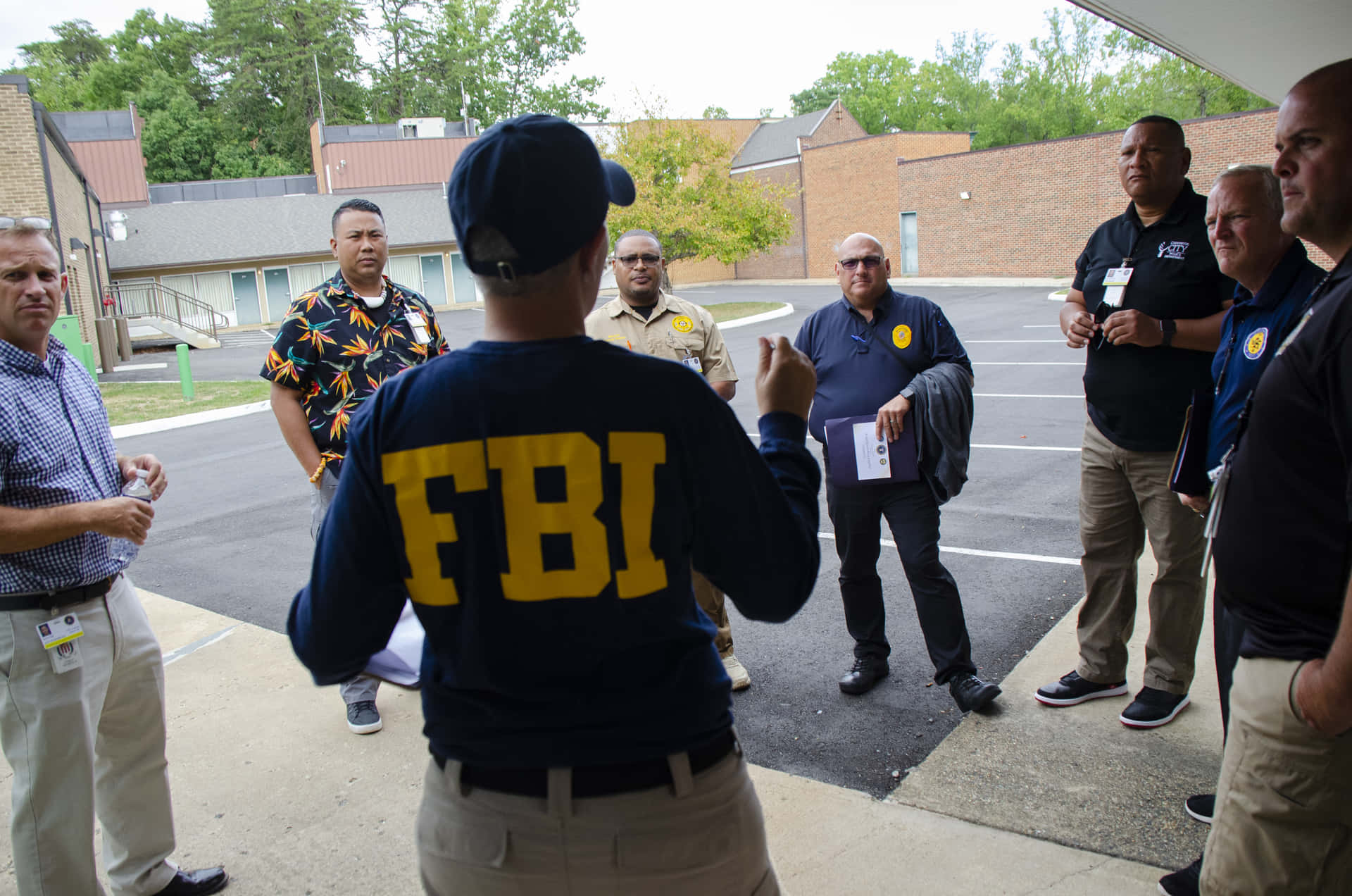 The Fbi Seal In The Forefront Background