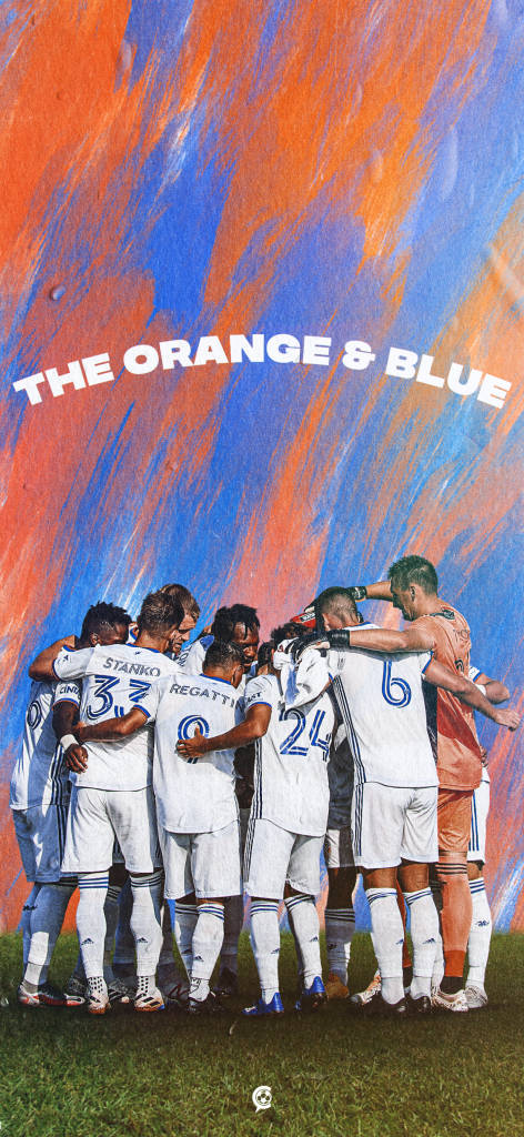 The Fc Cincinnati Soccer Players Making A Plan Background